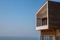 Side view of one modern penthouse apartmen with large balcony. Blue sky and horizon in the background. Royalty Free Stock Photo