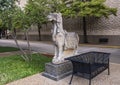 Side view of one of a pair of Chinese Tang Dynasty stone horses outside the World Trade Center in Dallas, Texas