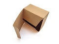 Side view of open brown recycled cardboard box isolated. Close up of lid and square organic box on white background. Biodegradable Royalty Free Stock Photo
