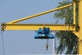 Telfer on beam in an open area outside building.