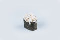 Japanese Gunkan Sushi with Tobiko caviar, rice and snow crab meat wrapped in nori seaweed.