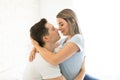 Passionate Couple About To Kiss In Brightly Lit Bedroom Royalty Free Stock Photo