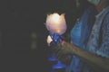 Side view: people holding lights and lighting candles, Buddhist concept, respect for various ceremonies.