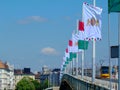 Side view of the Petofi bridge in Budapest, Hungary. Decorative flags. Blue sky. European travel concept Royalty Free Stock Photo