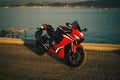 Side view photo of a Honda CBR 1000 RR fireblade racing motorcycle on a sea background