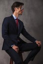 Side view picture of a seated young business man Royalty Free Stock Photo