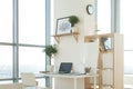 Side view picture of studio workplace with blank notebook, laptop. Designer comfortable work table, home office.