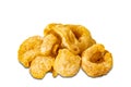 Side view pile of homemade crispy delicious deep fried pork rinds on white background