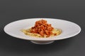 Side view of plate with spaghetti with fried ground-meat Royalty Free Stock Photo