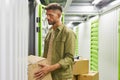 Man Loading Boxes in Storage Unit Royalty Free Stock Photo