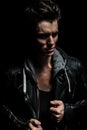 Side view portrait of a dramatic man in leather jacket Royalty Free Stock Photo