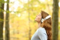 Female breathing fresh air wearing headphones Royalty Free Stock Photo