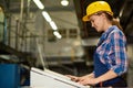 Young Woman Operating Machine Units at Factory Royalty Free Stock Photo