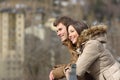 Couple sightseeing outdoors in the street in winter