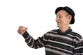 Side view portrait of the happy old man in casual clothes and black hat, senior holds denture in hand and looking at it Royalty Free Stock Photo