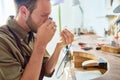 Young Jeweler Appraising Ring in Shop Royalty Free Stock Photo