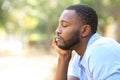 Man with black skin relaxing and resting in a park Royalty Free Stock Photo