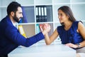 Side view portrait of man and woman armwrestling, exerting press