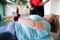 Obese Woman Exercising on Fitness Ball Royalty Free Stock Photo