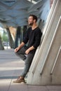 Side view portrait of smiling man standing outdoors Royalty Free Stock Photo