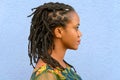 Side view portrait of a woman with dreadlocks Royalty Free Stock Photo