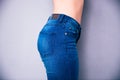 Side view portrait of a woman`s body part in jeans Royalty Free Stock Photo