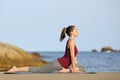 Yogi doing yoga pose on the beach