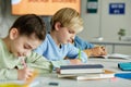 Boy Writing in School Royalty Free Stock Photo