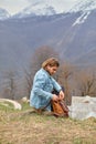 Side view portrait of young caucasian male opening backpack in nature Royalty Free Stock Photo