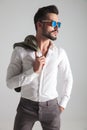 Side view portrait of a young fashion man wearing sunglasses Royalty Free Stock Photo
