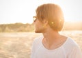 Side view portrait of a young guy in sunglasses Royalty Free Stock Photo