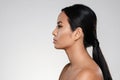 Side view portrait of a young half naked asian woman Royalty Free Stock Photo