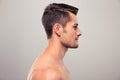 Side view portrait of a young man with nude torso Royalty Free Stock Photo