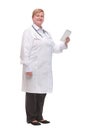 Side view of professional doctor or nurse woman in labcoat uniform with stethoscope on neck and check tablet smiles Royalty Free Stock Photo