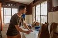 Professional male coffee taster working at production in Africa