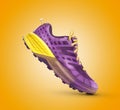 Side view of a purple and yellow lifestyle fashion running, sport shoe