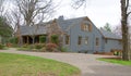 Side View of Ranch Style Cobblestone and Gray Home