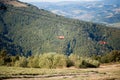 Side view of red chairlift ride to mountains with beautiful nature background.