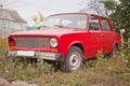 Side view of red old rusty car Royalty Free Stock Photo