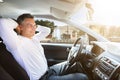 Relaxed Man Sitting In Self Driving Car Royalty Free Stock Photo