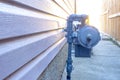 Side view of a residential urban natural gas meter, measuring gas consumption, outside house gas meter Royalty Free Stock Photo