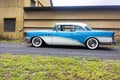 Side on view of a restored classic 1955 Buick car