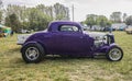 Side view of a restored purple circa 1932 vintage ford deuce coupe