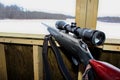 Side view of a rifle in a hunting blind Royalty Free Stock Photo