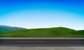 Side view of a road roadside, green meadow in the hills and clear blue sky background, vector illustration Royalty Free Stock Photo