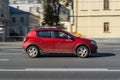 Side view rolling shot with Dacia Sandero Stepway subcompact car. Fast moving red Renault Sandero hatchback with motion blur Royalty Free Stock Photo