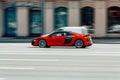 Side view rolling shot with red Audi R8 car on the street Royalty Free Stock Photo