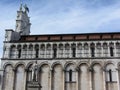 Side view of Roman Catholic basilica church of San Michele in Foro and Francesco Burlamacchi statue . Lucca, Italy Royalty Free Stock Photo