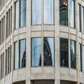 Side view of the rounded corner area of a modern building in the city centre of a large city Royalty Free Stock Photo