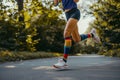 side view of runner midstride showcasing compression socks Royalty Free Stock Photo